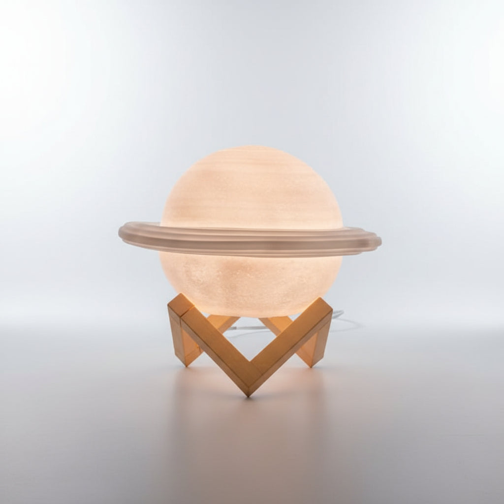 Decorative lamp shaped like Saturn on a black background