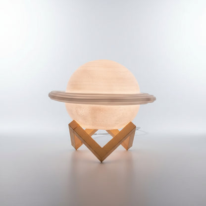Decorative lamp shaped like Saturn on a black background