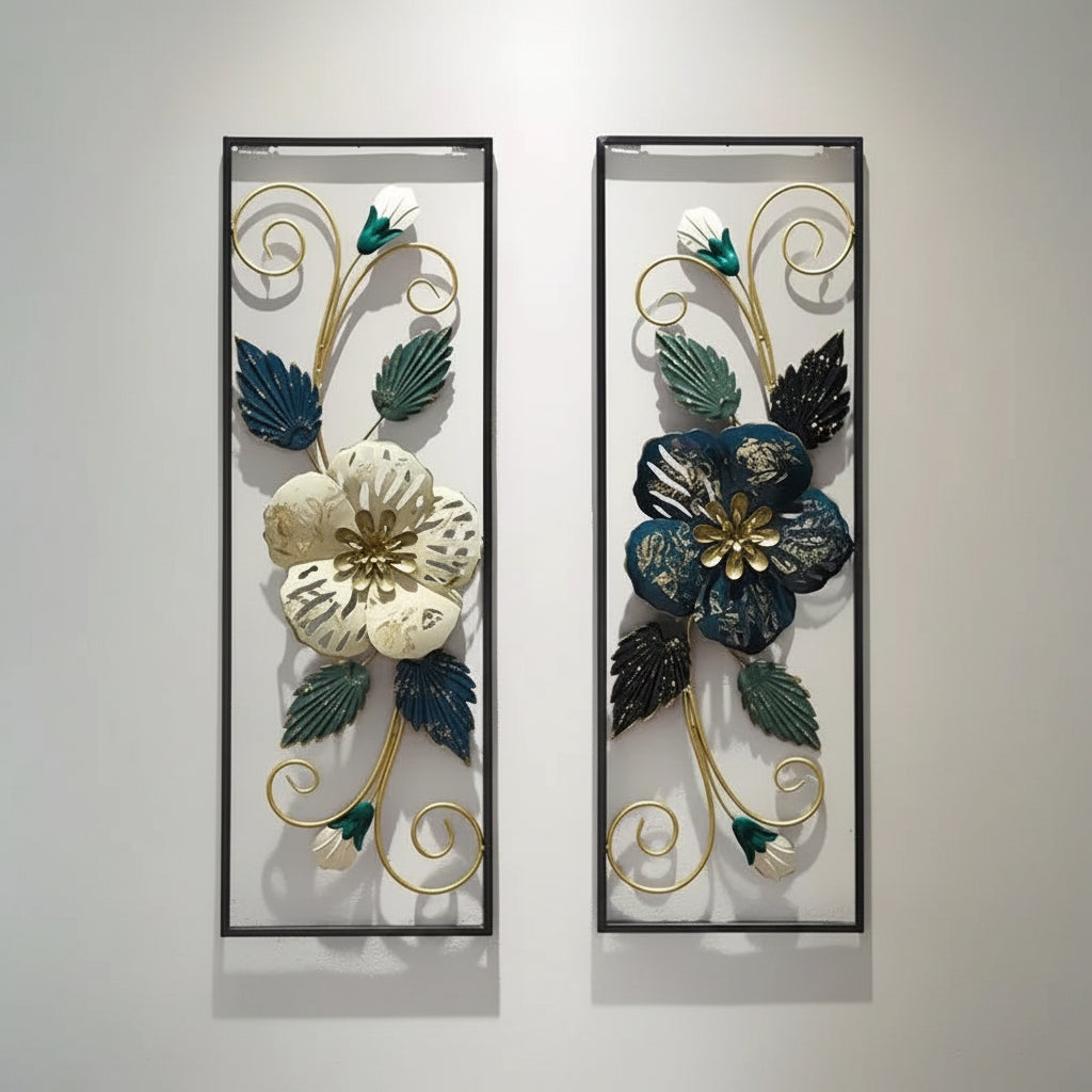 A set of two decorative metal floral wall decor pieces with a black frame, displayed on a white wall. The floral patterns are colorful and intricate, designed to add a touch of elegance and nature to any room.