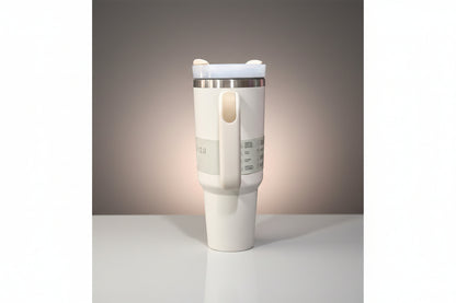 White travel mug with a handle on a white background