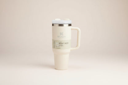 White Stanley travel mug with handle on a white background
