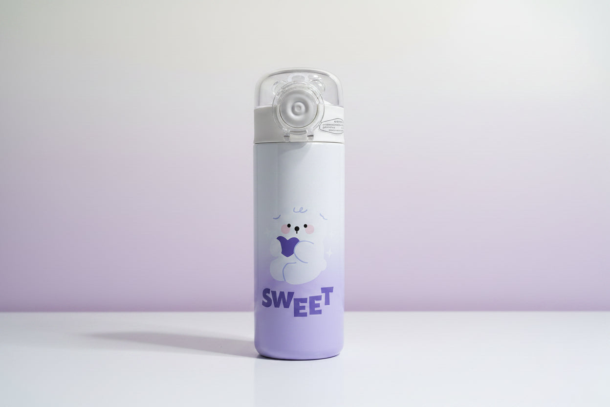 Purple water bottle with a cartoon character and 'sweet' text on a white background