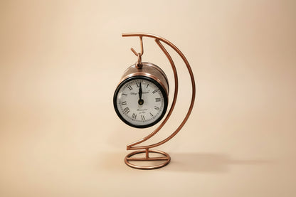 Decorative metal clock with a copper finish 