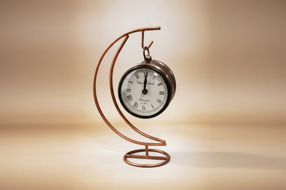 Decorative metal clock with a copper spiral design 