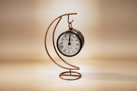 Decorative metal clock with a copper spiral design 