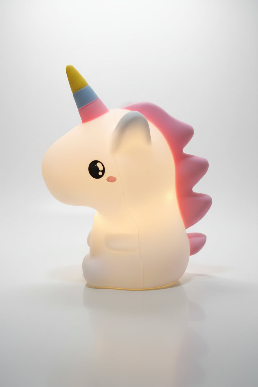 A multicolored unicorn-shaped night light glowing in a dark setting, designed for children's bedrooms.