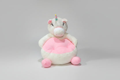 A pink and white plush sofa seat with a cartoon unicorn design suitable for children.