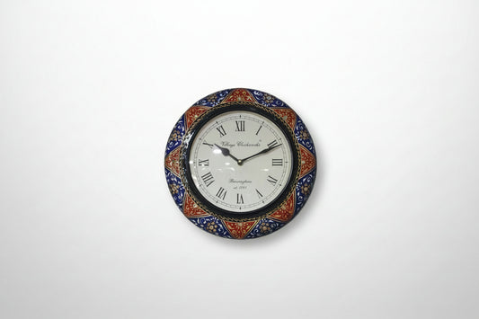 Decorative wall clock with colorful border on a white background