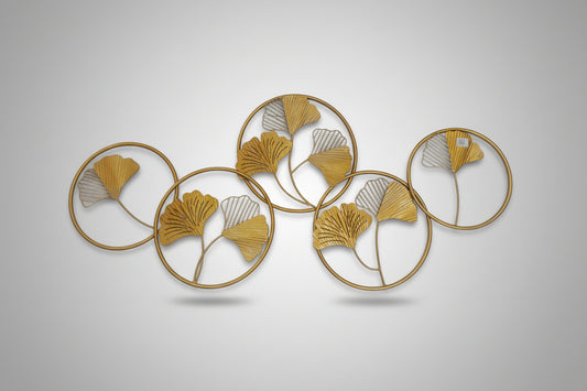 A 3D metal wall decoration featuring multiple overlapping circles with a gold finish.