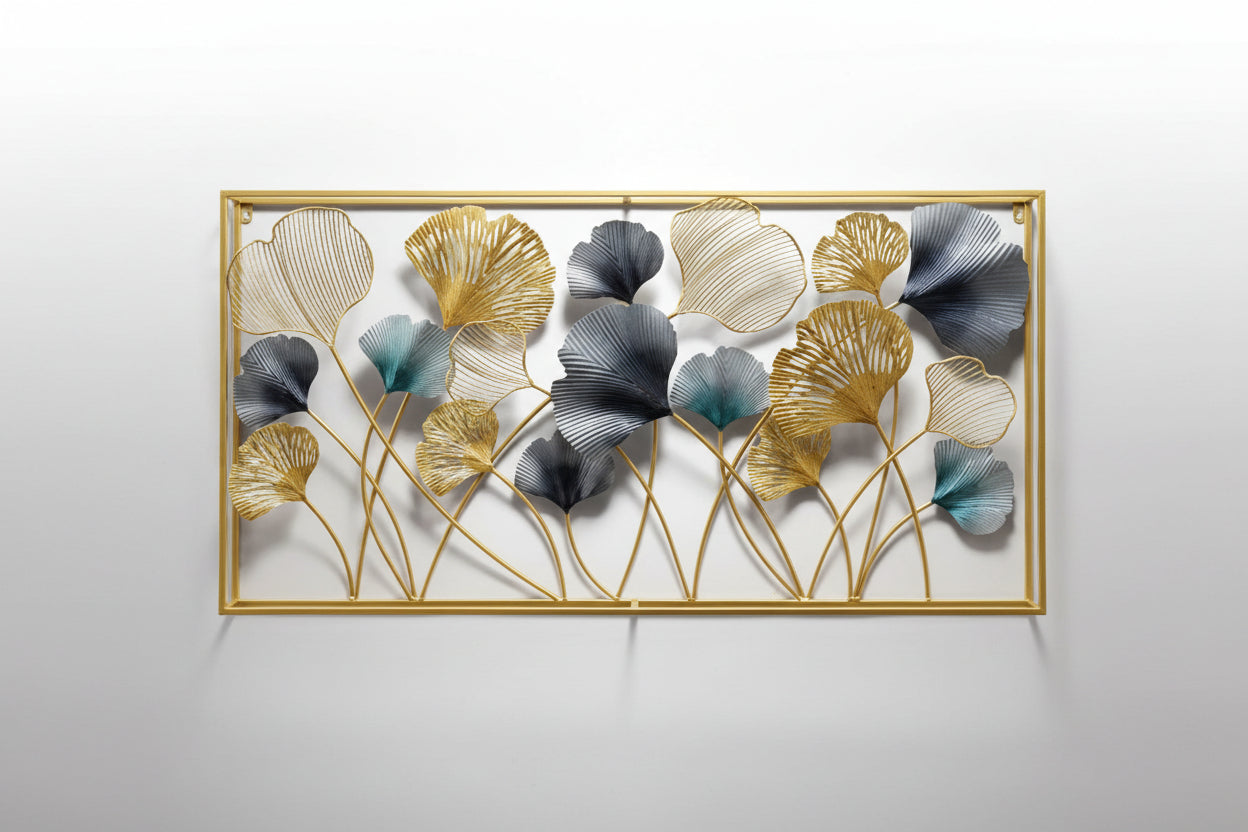 A wall-mounted wrought iron art piece with floral patterns in black, gold, and gray colors, displayed above a sofa with decorative pillows and a vase.