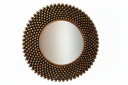 A wall mirror with a bronze-colored metal frame, featuring a round shape and a textured surface with spherical protrusions.