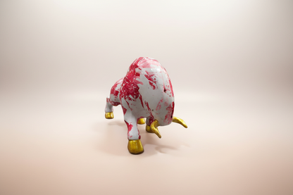 Marble-patterned toy bull with gold hooves on a white background
